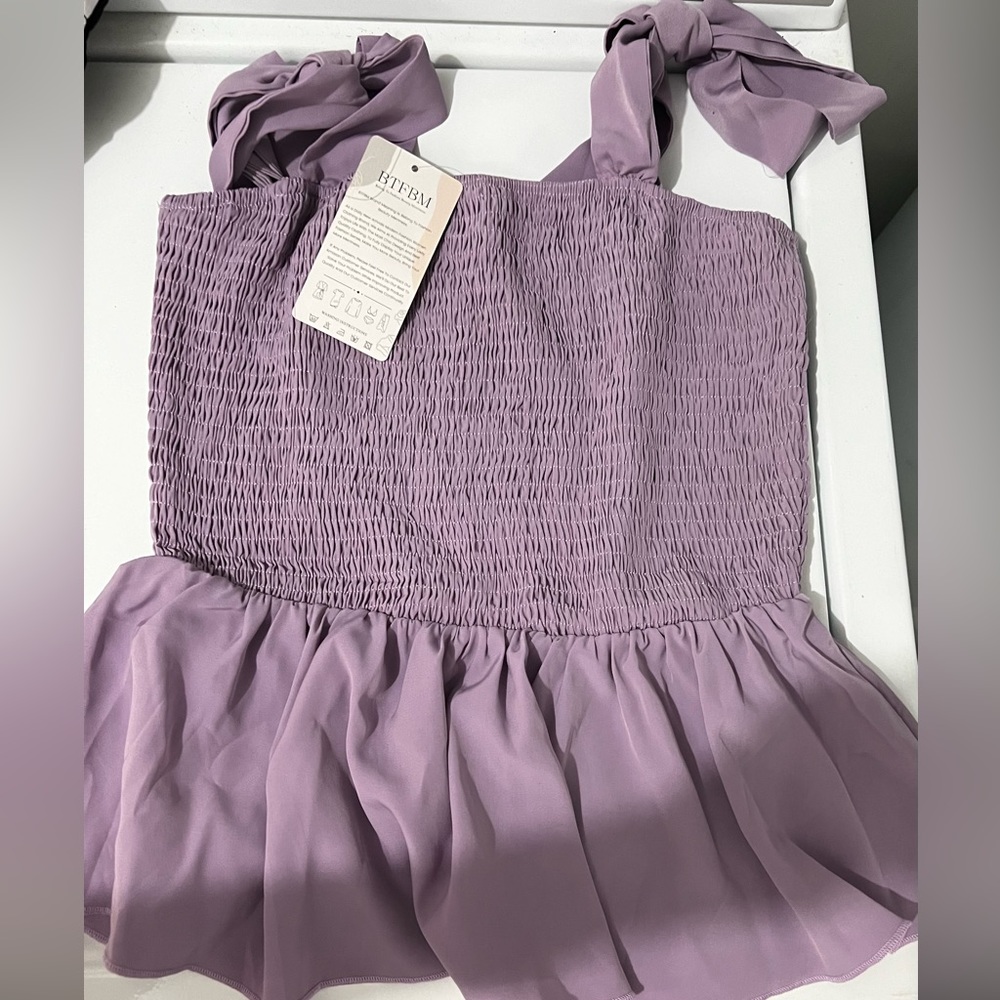 Purple tank - small but fits a small or medium- brand new